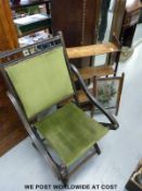 A Victorian folding chair, three tier bookcase and a hand painted glass screen.