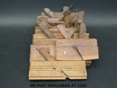 Eleven moulding planes to include dado planes, some marked to include A.