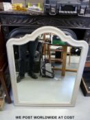 A pair of black framed mirrors with bevelled glass (96 x 66cm) together with a further mirror