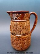 A treacle glazed jug with decoration of Eastington Church, Stroud,