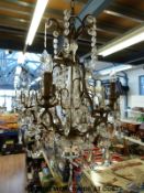 Three gilt metal chandeliers with drop decorations