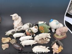 A collection of pig ornaments including a Carlton Ware pig jug, Beswick, Studio pottery,