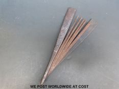 A Japanese Tessen or fighting fan with silver wire inlay in the sayagata pattern.