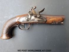 A continental flintlock hammer action overcoat pistol with chequered grip and 4.