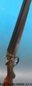 Unnamed 12 bore side by side double barrelled hammer action shotgun with engraving to the locks,