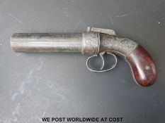 A replica Coopers Patent pepperbox revolver with shaped wooden grips, ornate engraving and 4.