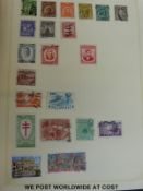 An all world collection in two loose filled albums and a quantity of loose stamps