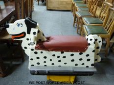 A mechanical playground rocking dog with ground spikes and fittings