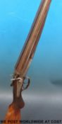 A deactivated Graham 12-bore double barrelled side by side shotgun with engraved decoration,