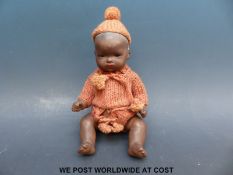 Armand Marseille bisque headed black baby doll with fixed brown eyes, closed mouth,