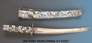 A Japanese wakizashi short sword with faux snake skin scabbard.