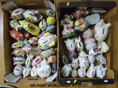 A collection of studio pottery collector's pigs including Guernsey pottery early slipware example