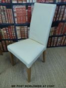 Four cream leather modern dining chairs
