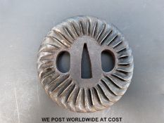 A Japanese Edo period tsuba with turbine style decoration.