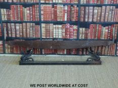 A cast iron and brass 19th century fire fender with gryphons to corners,