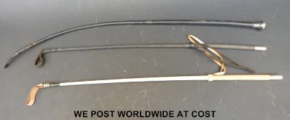 A silver topped riding crop by Swaine,