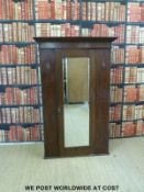 A small oak wardrobe with bevelled glass mirror (W104 D48 H161cm)