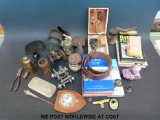 A quantity of military and other collectables to include books, WWI tank money box,