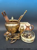 A collection of metalware including Cairo ware jardiniere, brass knobs, trivets,
