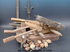 A collection of mainly wooden woodworking clamps