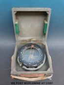 A cased WWII P4A aircraft compass