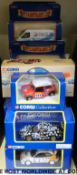 Twenty-one Corgi diecast model vehicles including Hauliers of Renown vans, fire engine,