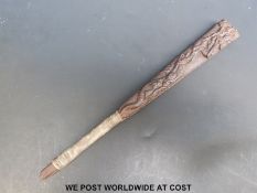 A Japanese mid Edo period Tessen or fighting fan with moulded decoration of tigers and dragons.