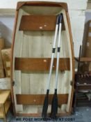 A fibreglass rowing boat and oars (length 202cm)