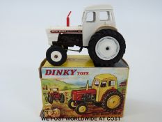 Dinky Toys diecast model David Brown Tractor 305, with white body, hubs, and rear attachment,