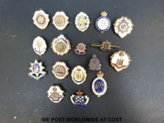 A collection of enamelled military badges including Suffolk Regiment, Army Cyclist Corps,
