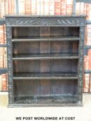 A carved oak bookcase (W91 D30 H108)