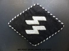 A WWII SS Officer's collar tab, embroidered in silver thread,