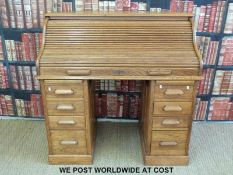 An oak roll top desk,