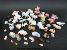 A collection of miniature ceramic pigs to include Crested ware, Studio pottery, glass etc.