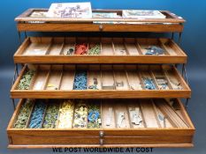 A large collection of Airfix model soldiers in wooden folding concertina action collector's cabinet.