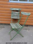 Four vintage wooden-seated folding garden chairs