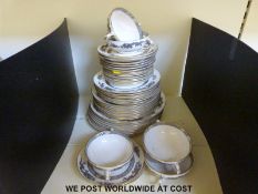 A Crown Staffordshire Black Mandarin part dinner service with some sets of eight