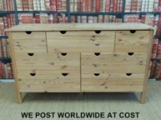 A pine chest of seven drawers (W150 D52 H86cm)