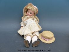 Heubach Koppelsdorf bisque headed doll with weighted blue eyes, open mouth,