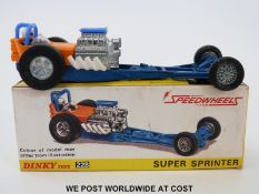 Dinky Toys diecast model Super Sprinter, 228, with orange body and blue chassis, in original box.