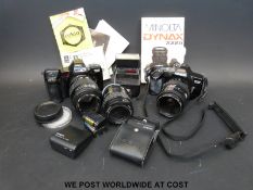A collection of vintage cameras including Minolta, Dyrax 7000i, Dyrax 3000i,