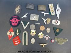 A quantity of Nazi German insignia, badges, belt buckles etc to include Luftwaffe, SA, epaulettes,