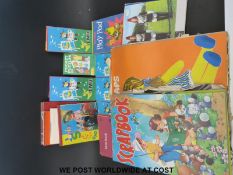 A collection of 1960 / 70's puzzle books, scrap books, colouring pencils and paint boxes,