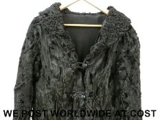 A ladies silk lined French coat with bow loop decoration