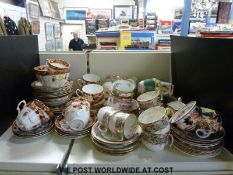 A quantity of hand decorated tea ware including two cake plates,