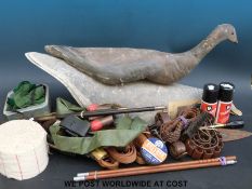 A collection of gun and shooting related items including three goose decoys, cleaning kits,