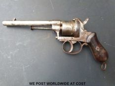 A 9mm six-shot rim-fire service revolver with shaped wooden grips and 5.