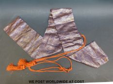 A modern silk Japanese Kutana sword bag.