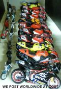 Twenty-two model motorbikes of various scales,