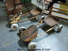 A pair of vintage metal pedal cars/ go-karts c1950